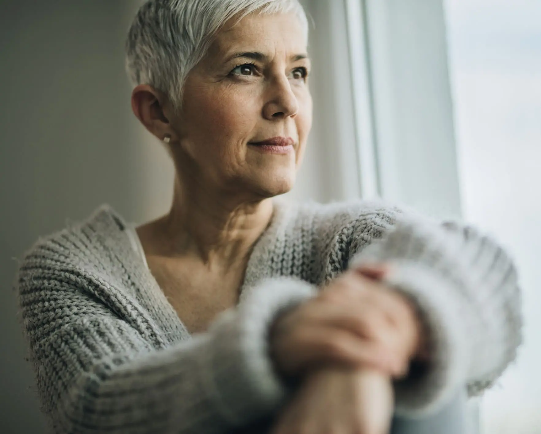 Portrait of beautiful mature woman relaxing by the window. XEO in Charleston County, SC